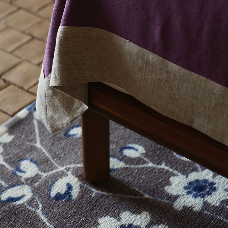 leg detail on a de la espada dubois bed low headboard with bedside tables