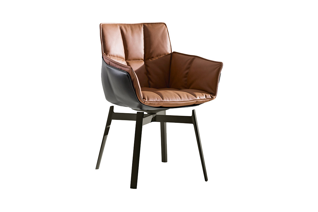 b&b italia husk chair with metal base on a white background