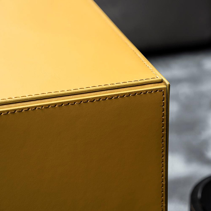 minotti solid saddle-hide side table or pouf in situ