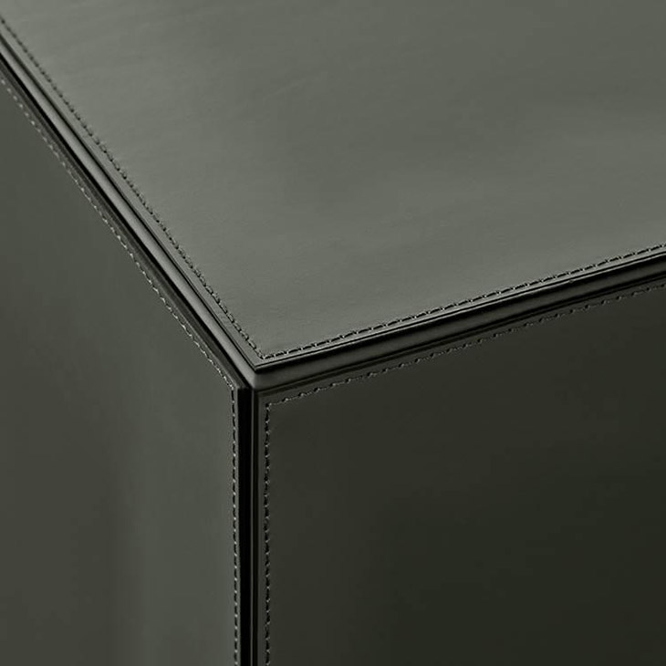 minotti solid saddle-hide side table or pouf in situ