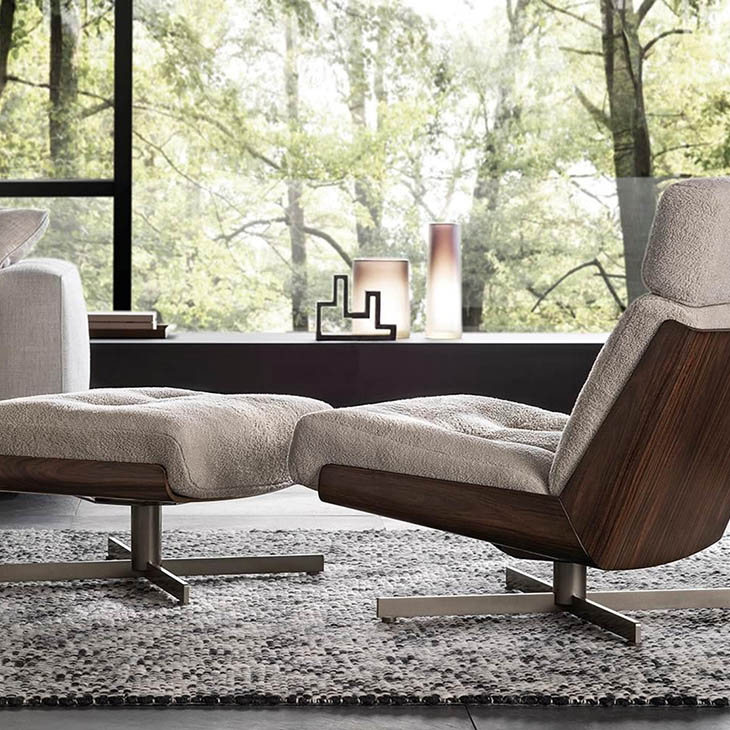 minotti daiki swivel bergere armchair and ottoman in situ
