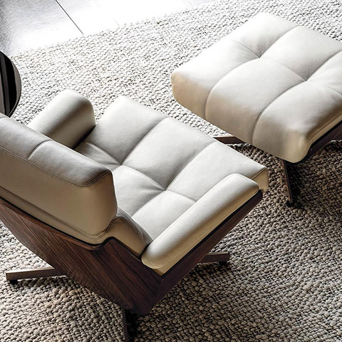 minotti daiki swivel bergere armchair and ottoman in situ