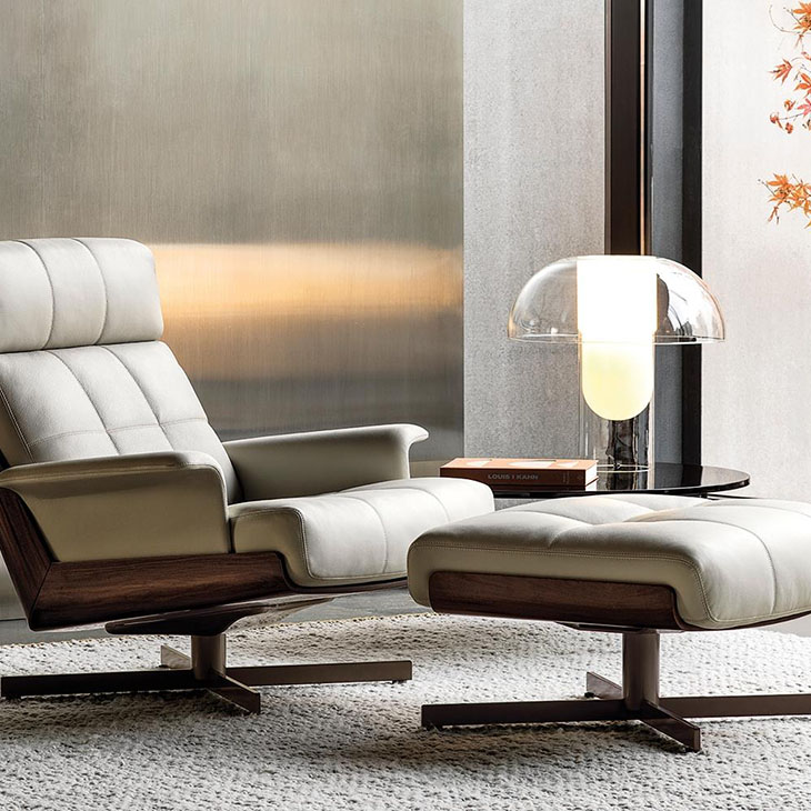 minotti daiki swivel bergere armchair and ottoman in situ